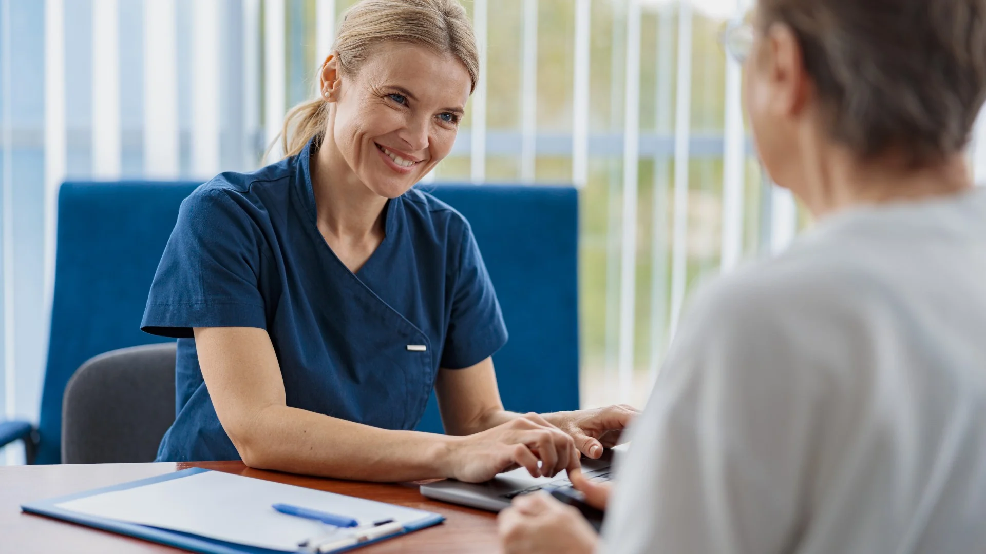 A clinician with a patient at the practice